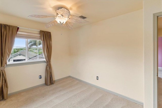 unfurnished room with light carpet and ceiling fan