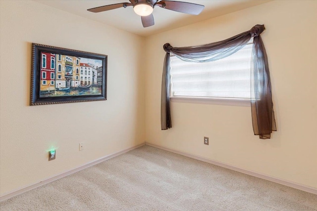 empty room with light carpet and ceiling fan