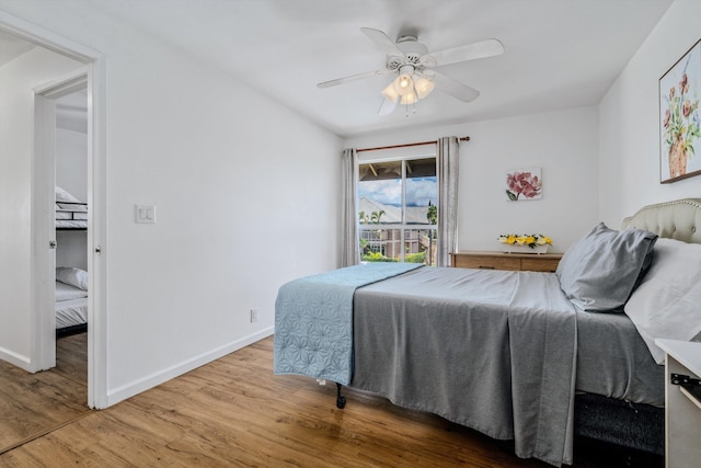 bedroom with wood-type flooring and ceiling fan