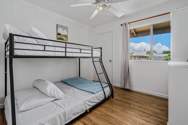 bedroom with hardwood / wood-style flooring and ceiling fan