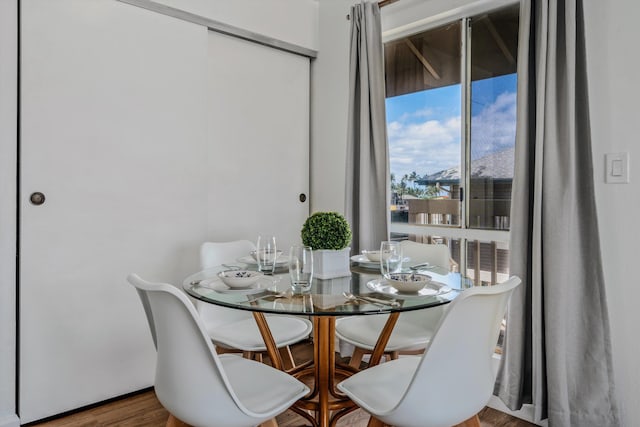 dining room with hardwood / wood-style flooring