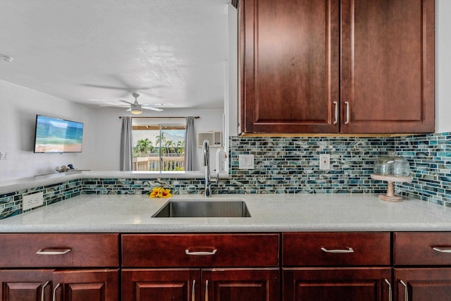 kitchen with ceiling fan, sink, and decorative backsplash