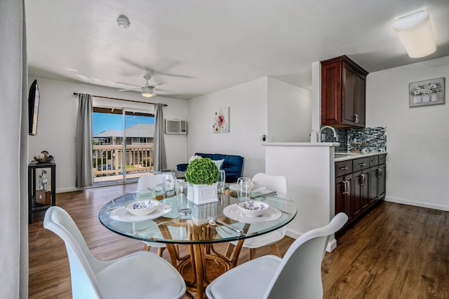 dining room with dark wood-type flooring and ceiling fan