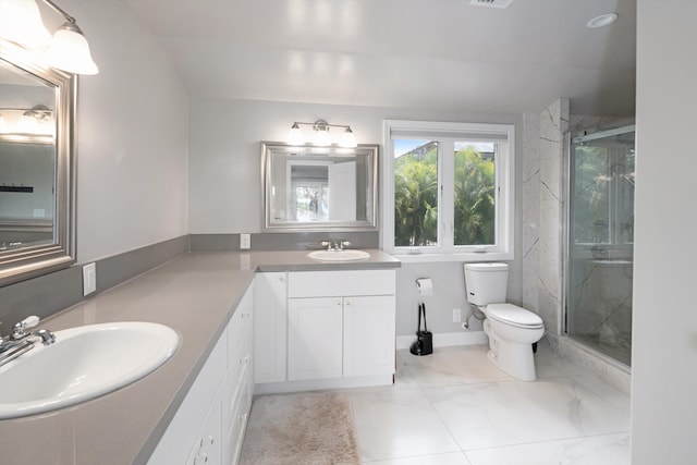 bathroom with vanity, toilet, and walk in shower