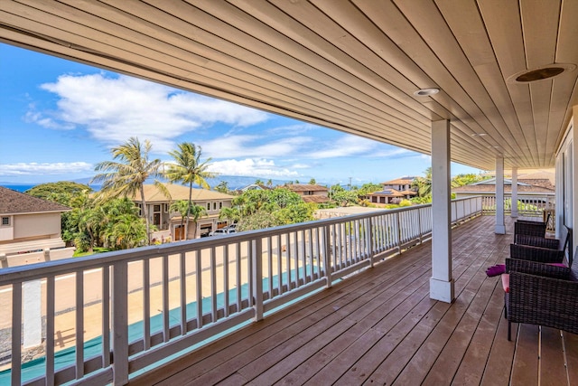 wooden deck featuring a fenced in pool