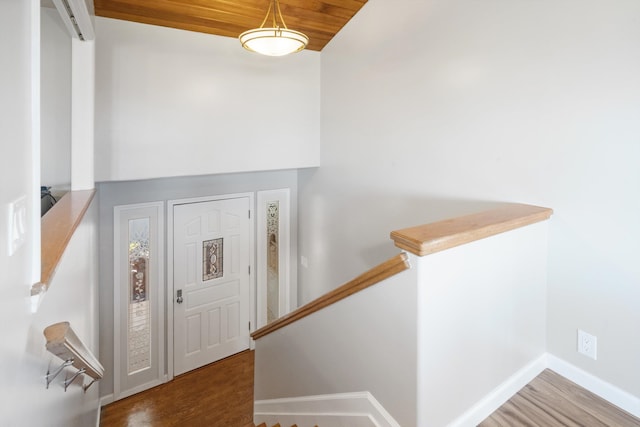 entrance foyer with wood ceiling and wood-type flooring