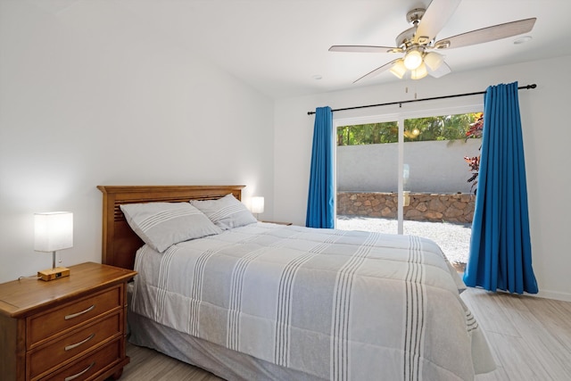 bedroom featuring access to exterior, light wood-type flooring, and ceiling fan