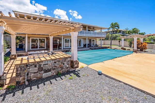 view of pool with a patio and a pergola