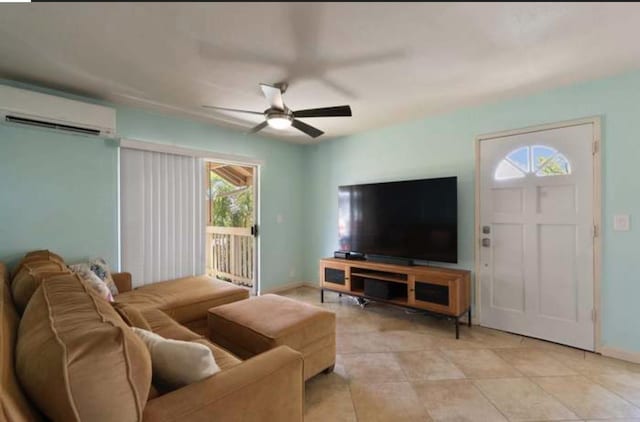 living room featuring ceiling fan, light tile patterned floors, and a wall mounted AC