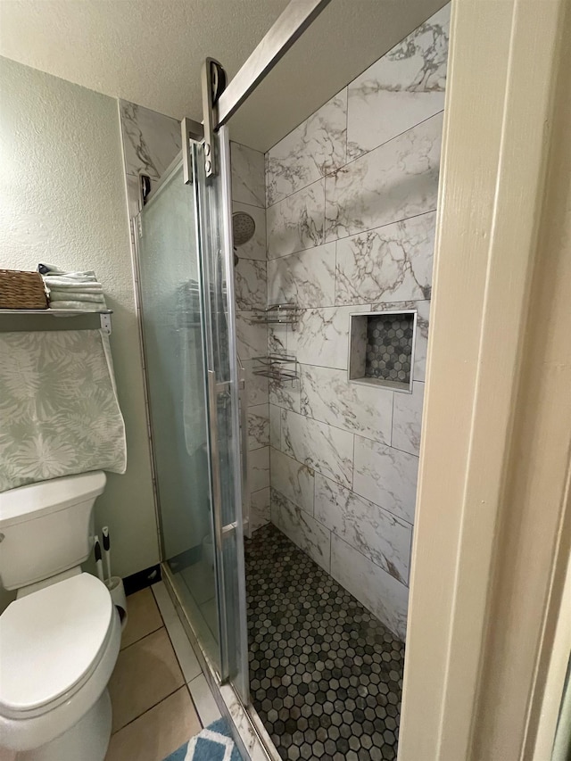 bathroom with walk in shower and toilet