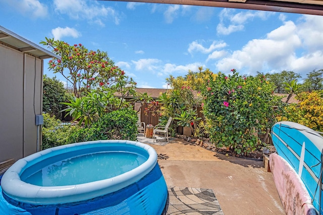 view of pool with a patio area and a fenced backyard