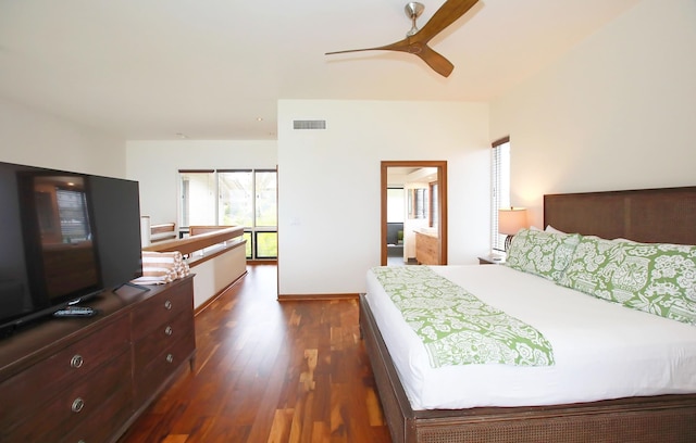 bedroom featuring ceiling fan, dark wood-type flooring, and ensuite bathroom