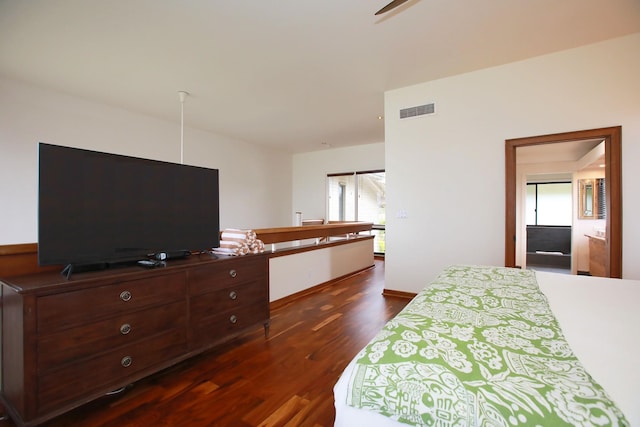 bedroom featuring dark hardwood / wood-style flooring