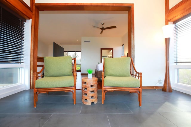 living area featuring ceiling fan