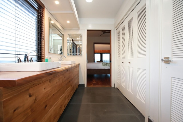 corridor with dark hardwood / wood-style flooring and sink