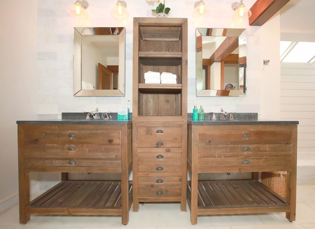 bathroom featuring tile flooring and vanity