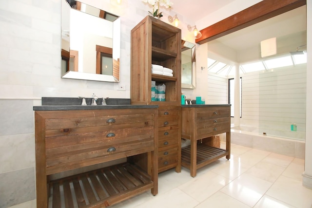 bathroom featuring vanity, tile floors, and shower / bathtub combination