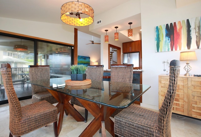 dining area with lofted ceiling and ceiling fan