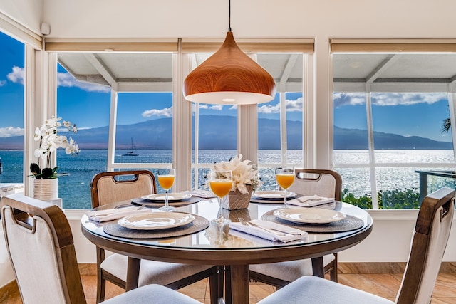 dining area featuring a water view