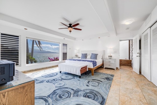 bedroom with light tile patterned floors and ceiling fan