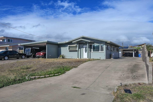 view of front facade featuring a carport and a sunroom