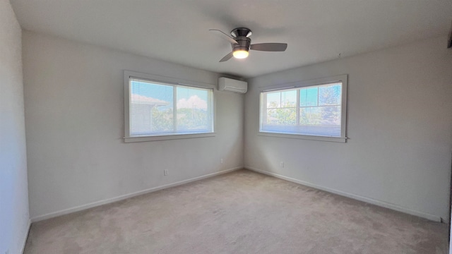 unfurnished room with light carpet, ceiling fan, baseboards, and a wall mounted AC