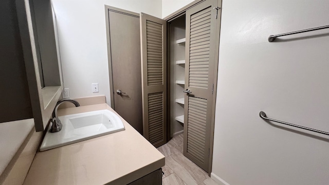 laundry room featuring light hardwood / wood-style flooring and sink