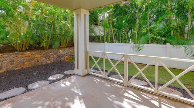 view of patio featuring fence
