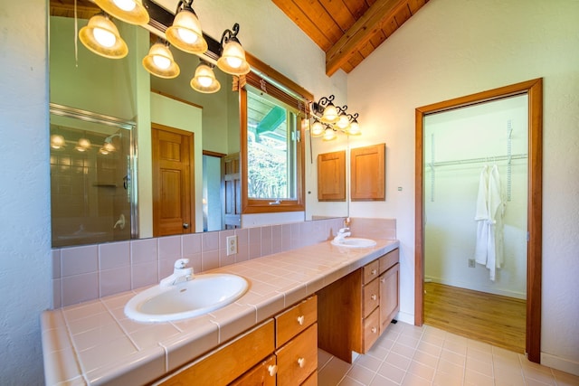 bathroom with wooden ceiling, tasteful backsplash, an enclosed shower, vaulted ceiling, and vanity