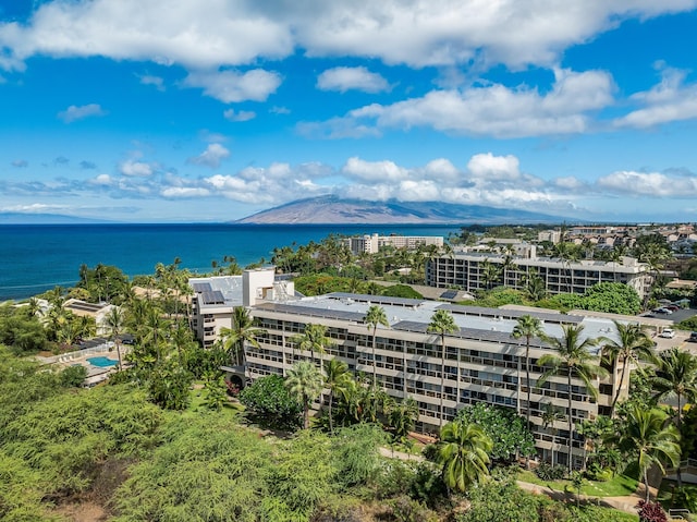 drone / aerial view featuring a water and mountain view