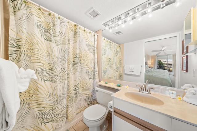 ensuite bathroom with vanity, toilet, a ceiling fan, ensuite bathroom, and visible vents