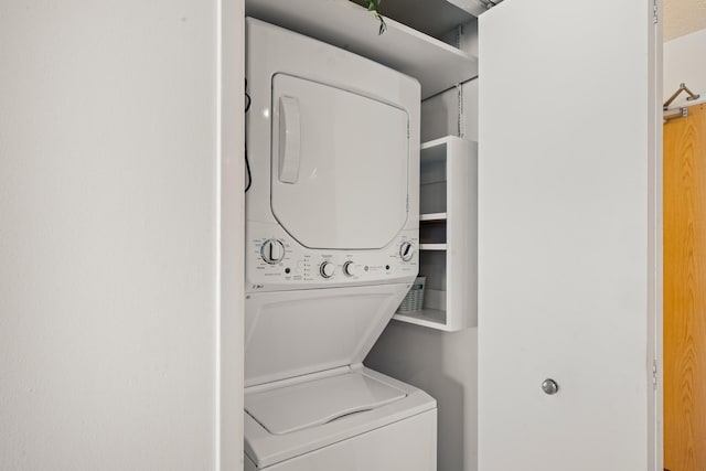 laundry room featuring laundry area and stacked washing maching and dryer