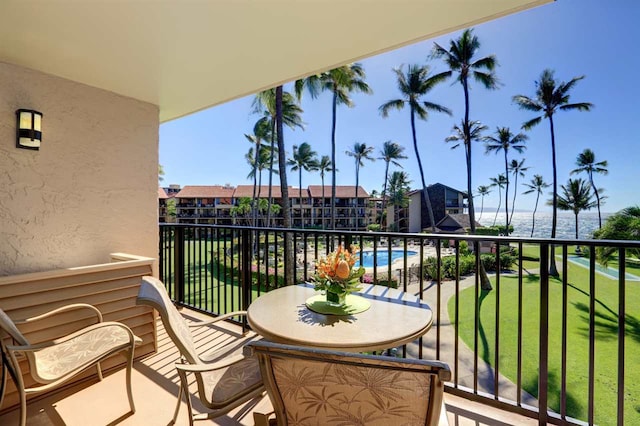 balcony featuring a water view