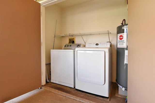 laundry room featuring laundry area, independent washer and dryer, and water heater