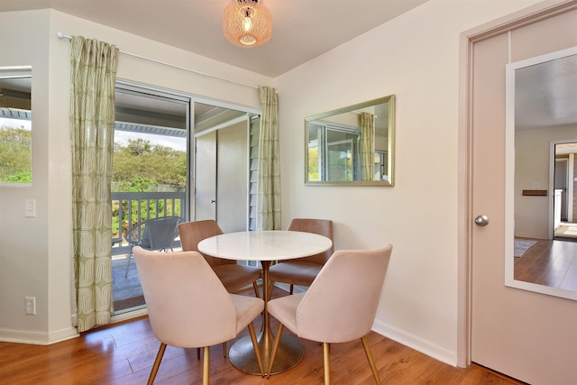 dining room with wood finished floors and baseboards