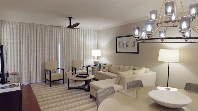 living area with ceiling fan, ornamental molding, and light wood-style flooring