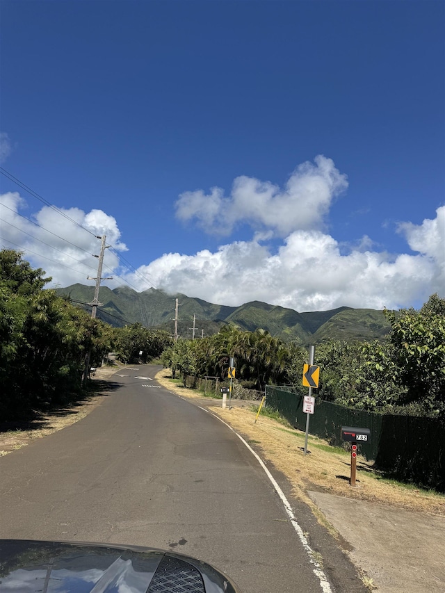 1368 Malaihi Rd, Wailuku, HI 96793 - view of asphalt street with a mountain view and traffic signs