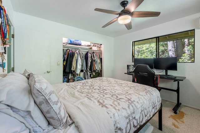 carpeted bedroom with a closet and ceiling fan