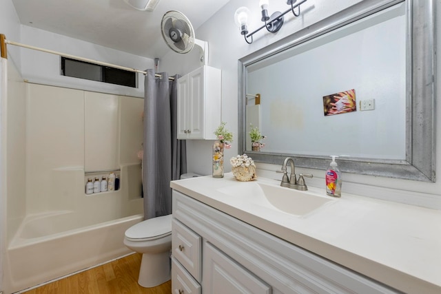 full bathroom featuring hardwood / wood-style floors, vanity, toilet, and shower / bath combination with curtain