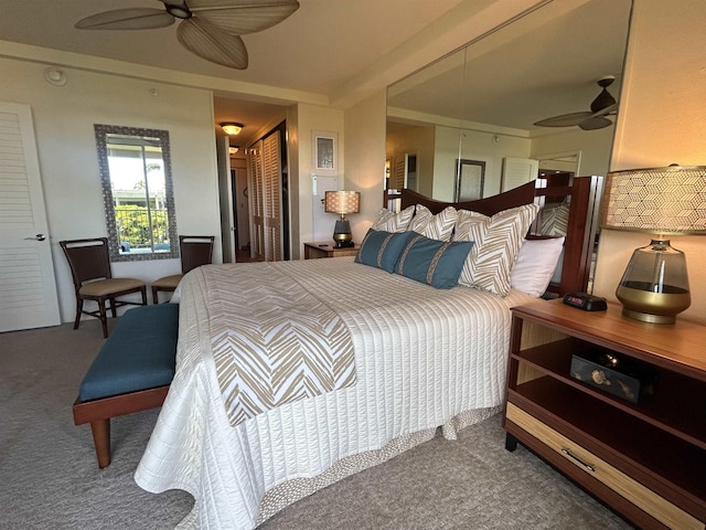 carpeted bedroom featuring a closet and ceiling fan