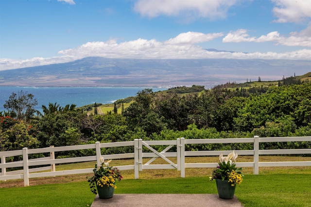 view of mountain feature with a rural view and a water view