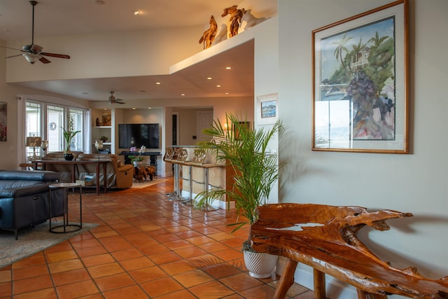 interior space with ceiling fan, tile patterned floors, and built in features