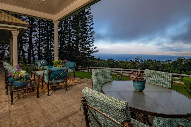 view of patio terrace at dusk