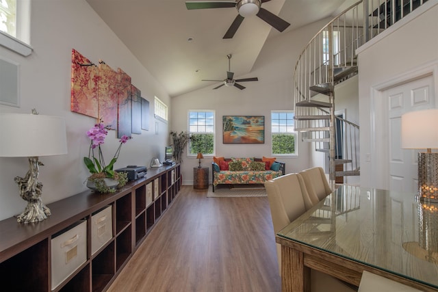 interior space with high vaulted ceiling, wood-type flooring, and ceiling fan