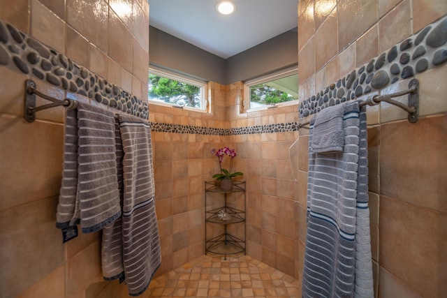 bathroom featuring a tile shower