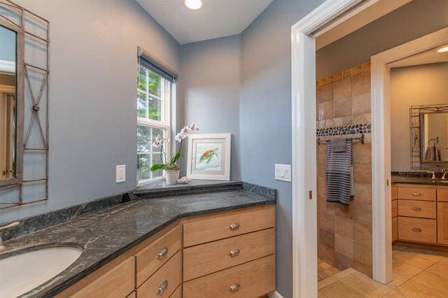 bathroom featuring tile patterned floors and vanity