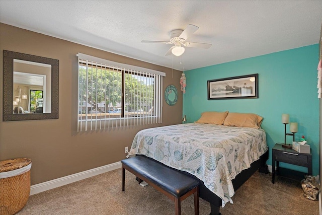 bedroom with ceiling fan and carpet