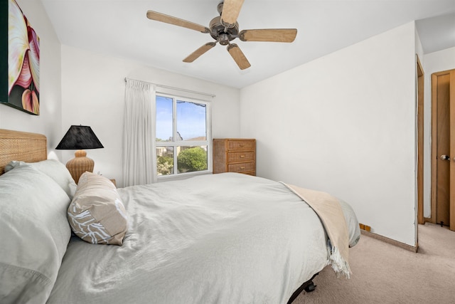 bedroom with ceiling fan and carpet floors