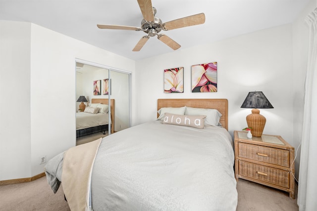 bedroom featuring light carpet, a closet, and ceiling fan