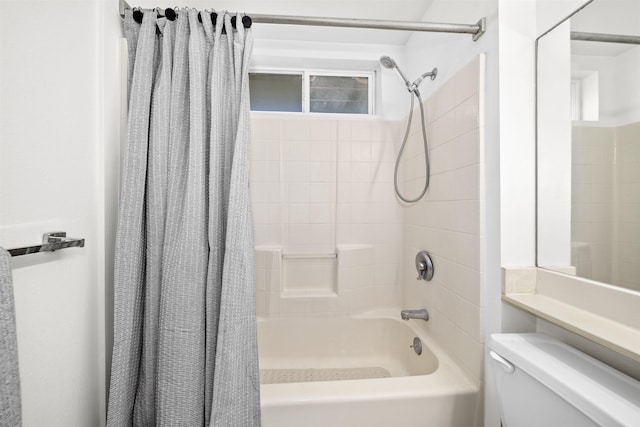 bathroom featuring toilet and shower / bath combination with curtain